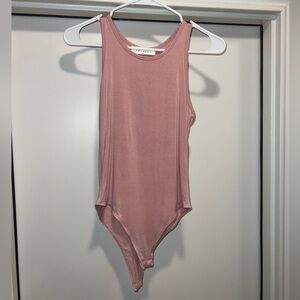 Light pink body suit! NEVER WORN!!
